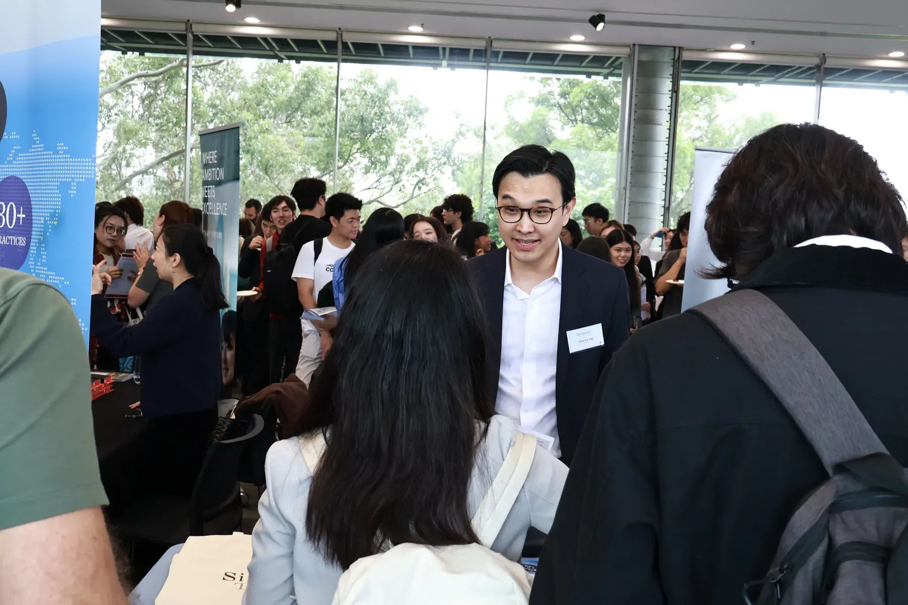 Students networking with law firms at the Hong Kong Law Fair
