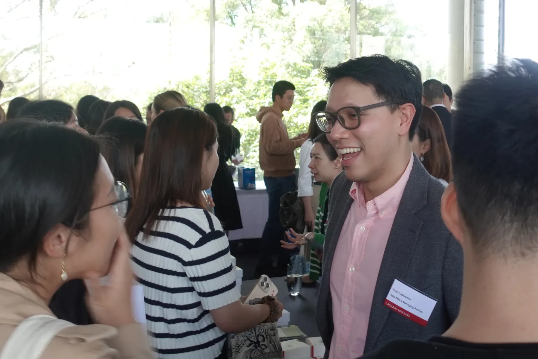A firm partner talking with students at the Hong Kong Law Fair