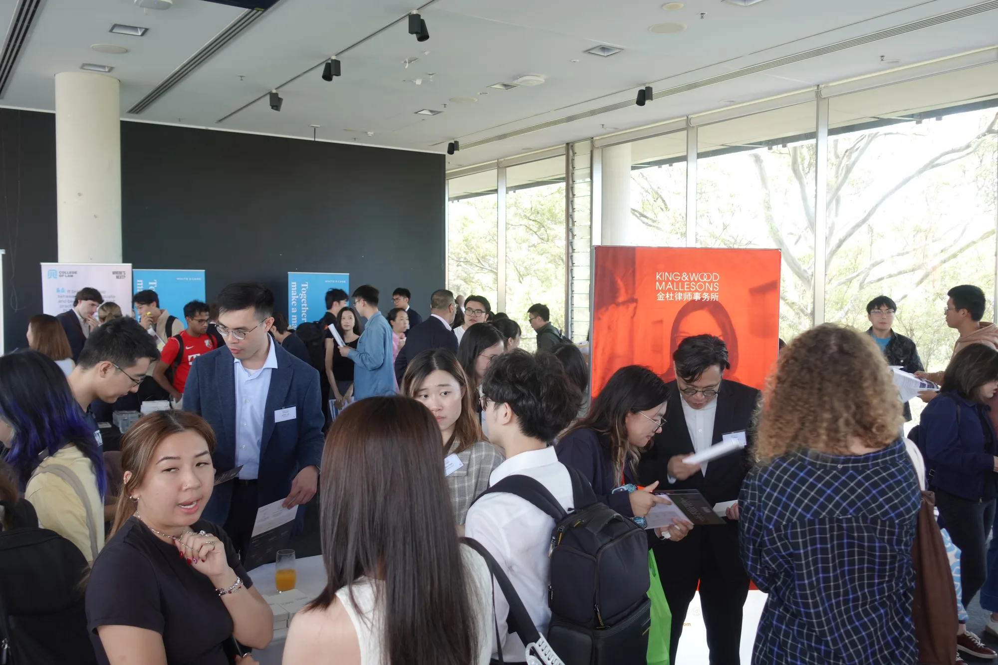 Students networking with law firms at the CLSS Hong Kong Law Fair